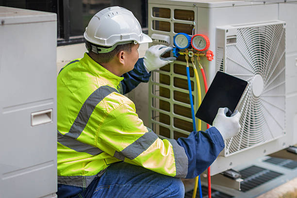 Professional Air Conditioning Repair technician working in New Smyrna Beach, FL